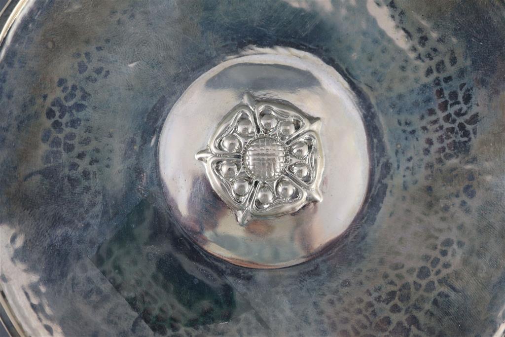 A George V Arts & Crafts Omar Ramsden planished silver Tudor Rose shallow dish,